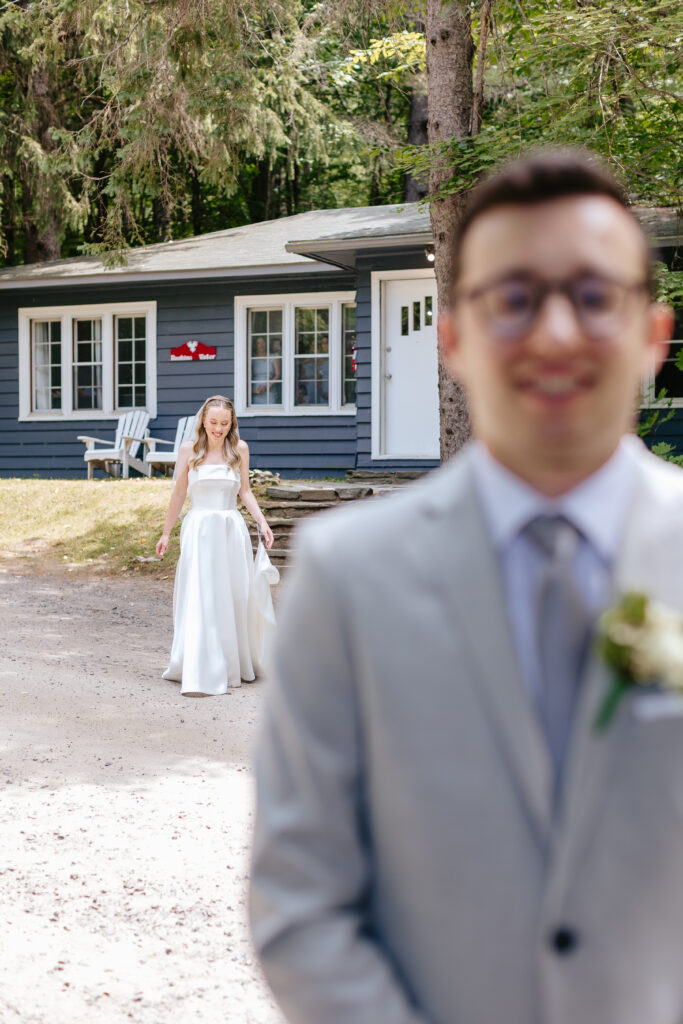 Bride and groom have first look lakeside at their Muskoka wedding.