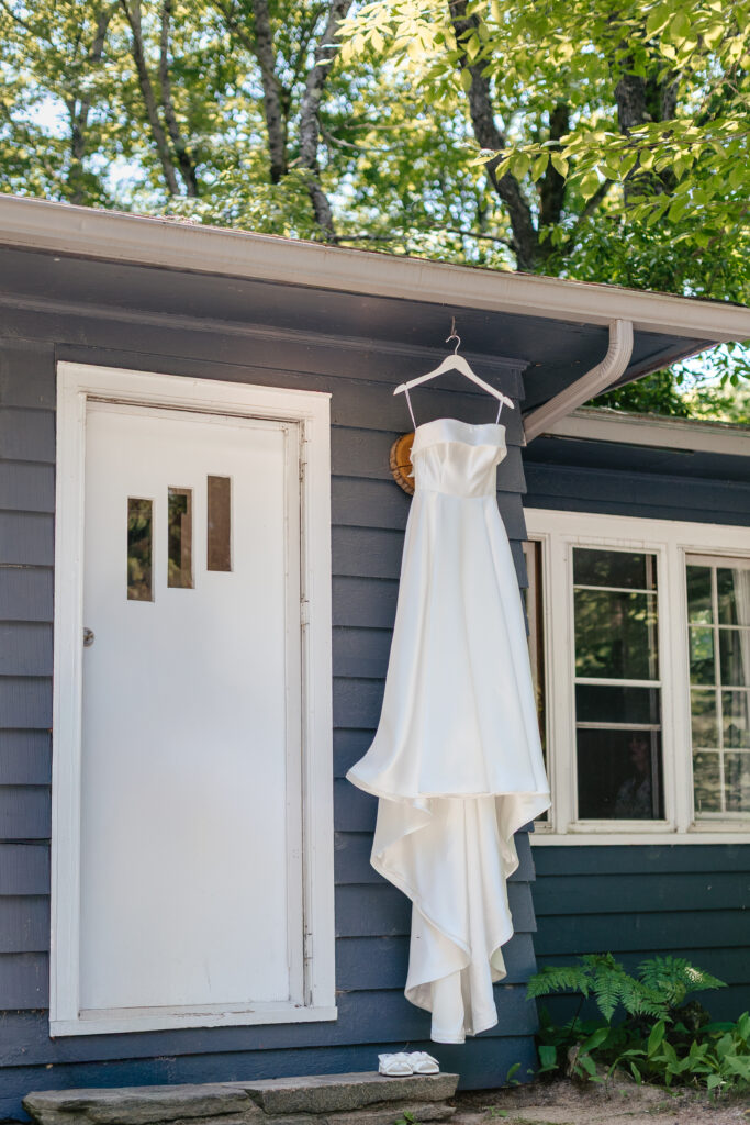 Wedding dress hanging at cottage for Muskoka Wedding day.